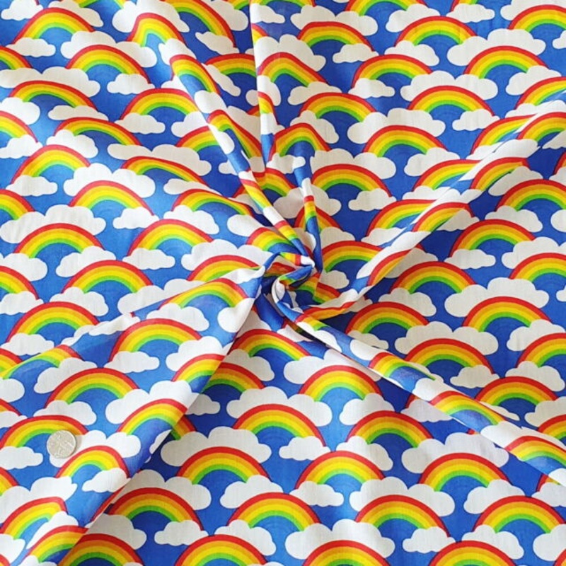 1 Metre Rainbows and Clouds Polycotton Fabric Royal Blue Background x 43