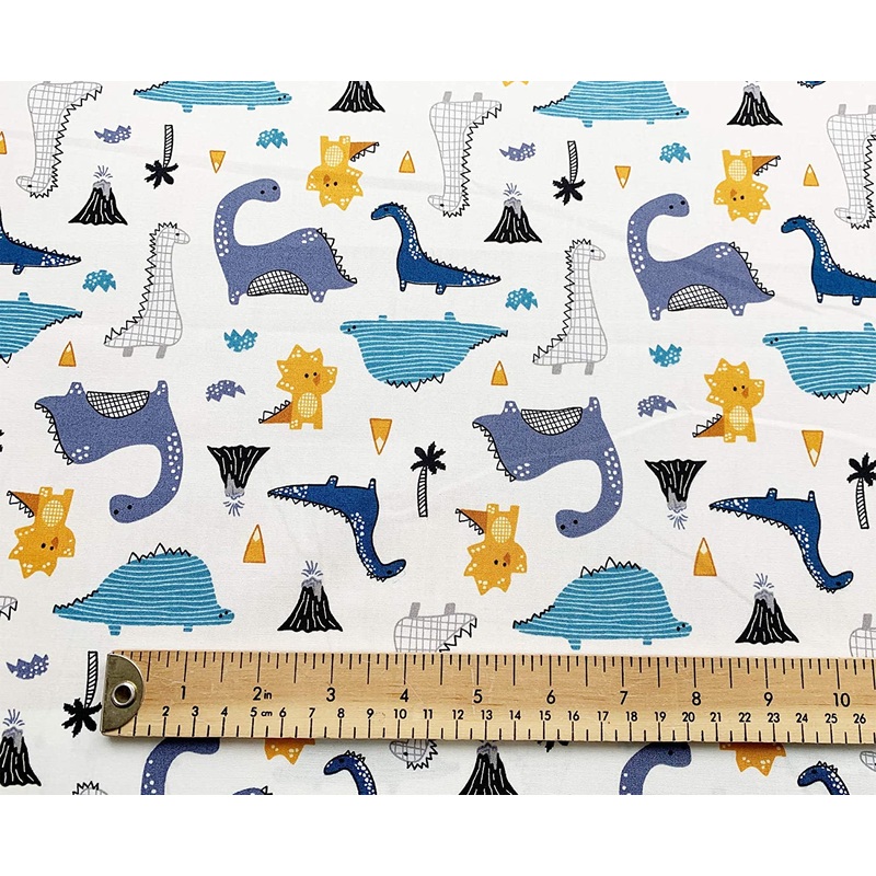 1M 100% Cotton Poplin Blue dinosaurs on Ivory Fabric Width: 110cm (45 inches) till code V789