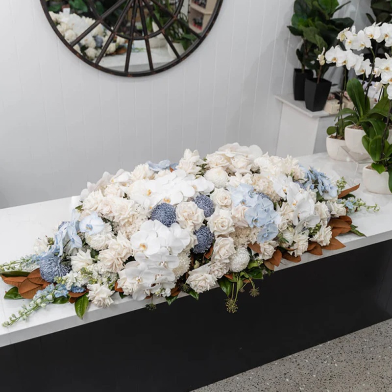 Soft Blue And White Casket Flowers