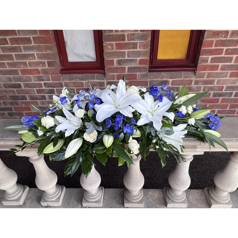 Blue and white Lily  Casket Spray
