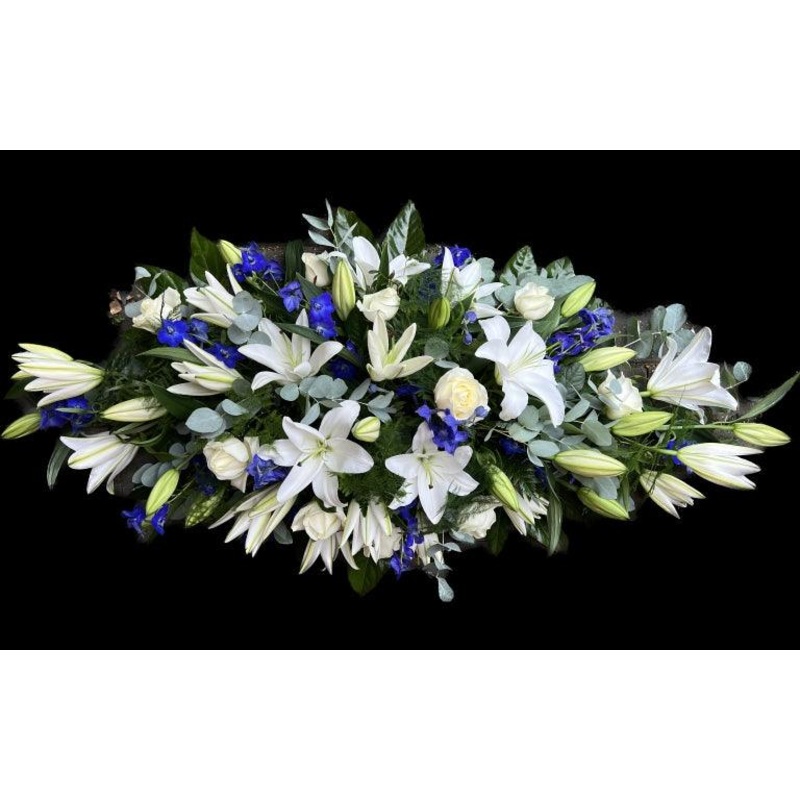 Lily rose and Delphinium casket spray