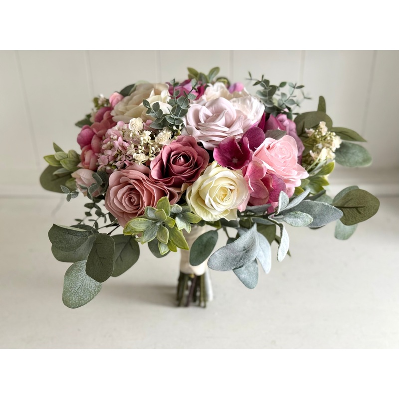 Pink and cream artificial wedding flowers. Roses and peonies.