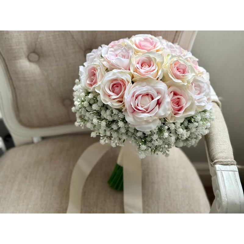 Pretty pale pink and ivory two tone roses and gypsophila wedding flowers.
