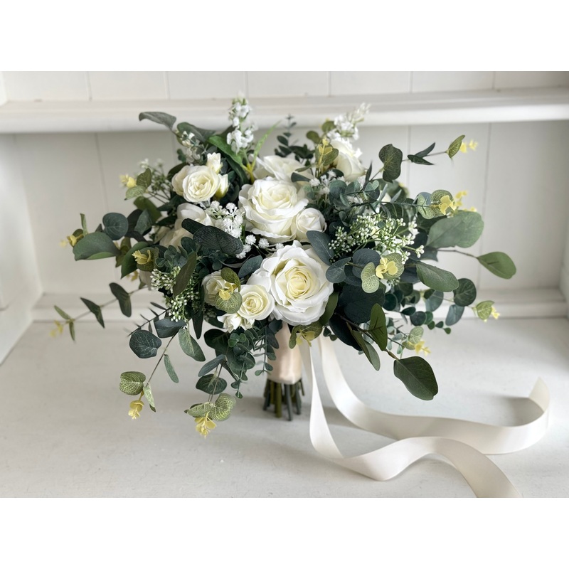 Rustic white and green wedding flowers with eucalyptus greenery.
