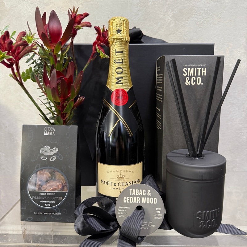 Smith & Co. Tabac and Cedar Wood Diffuser, Bottle of Moet, small native bud vase and Milk Choc Peanut Clusters
