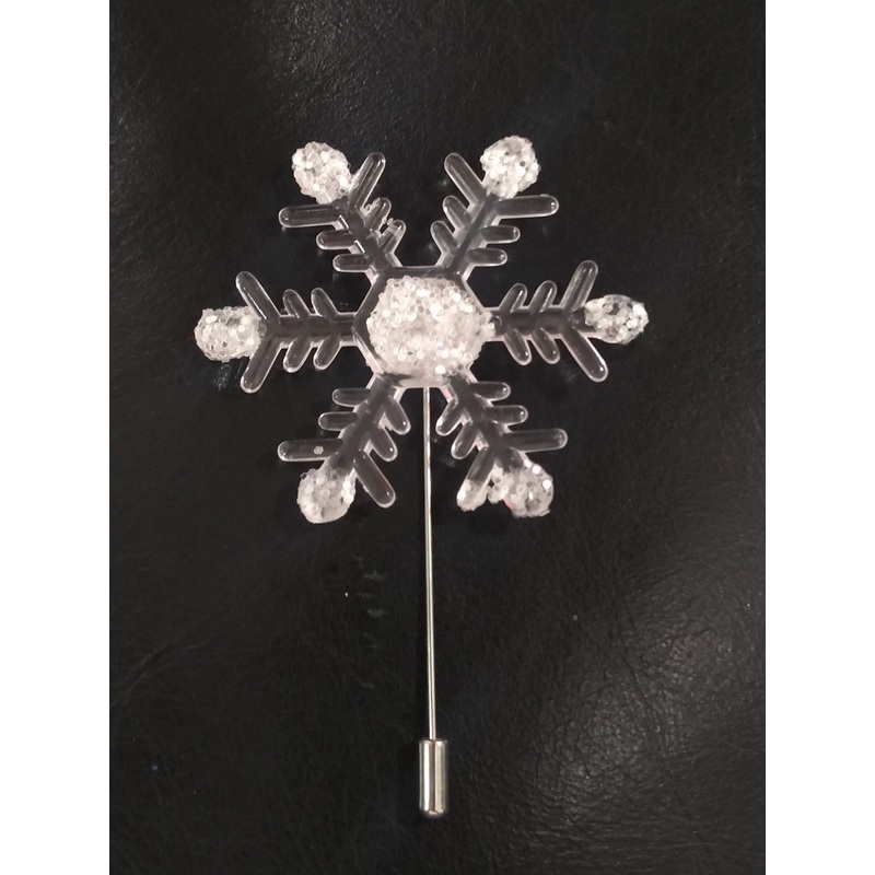 Snowflake buttonhole  and corsage  accessories for a Winter wedding