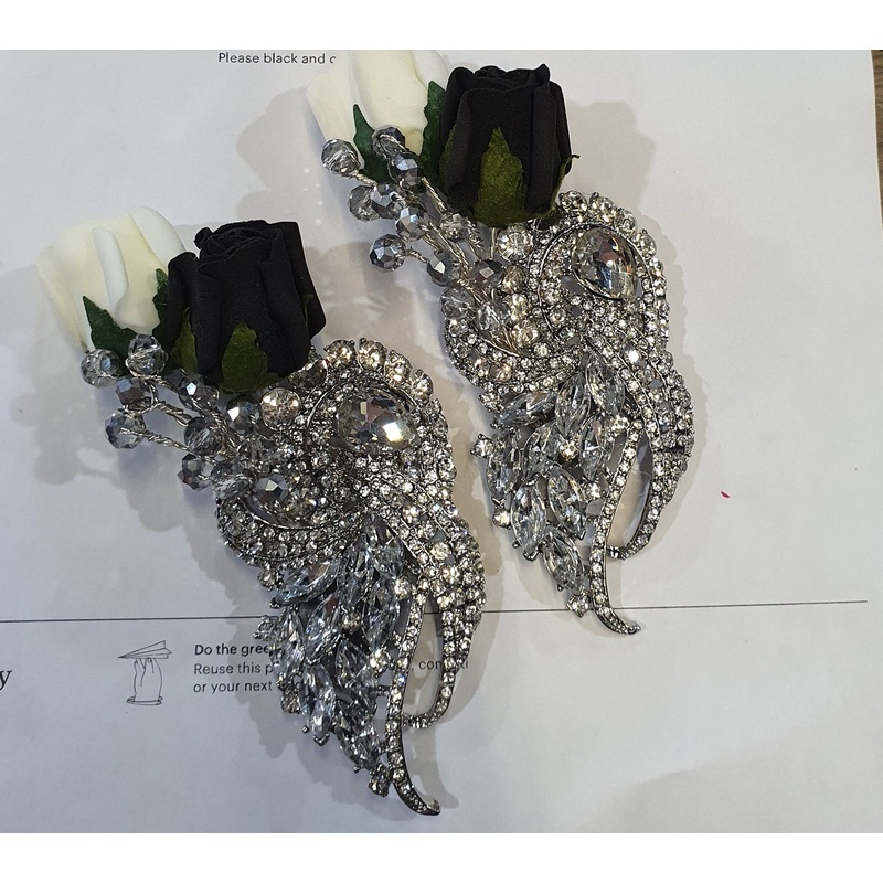 Crystal brooch  buttonhole  with  ivory and black foam roses by Crystal wedding uk