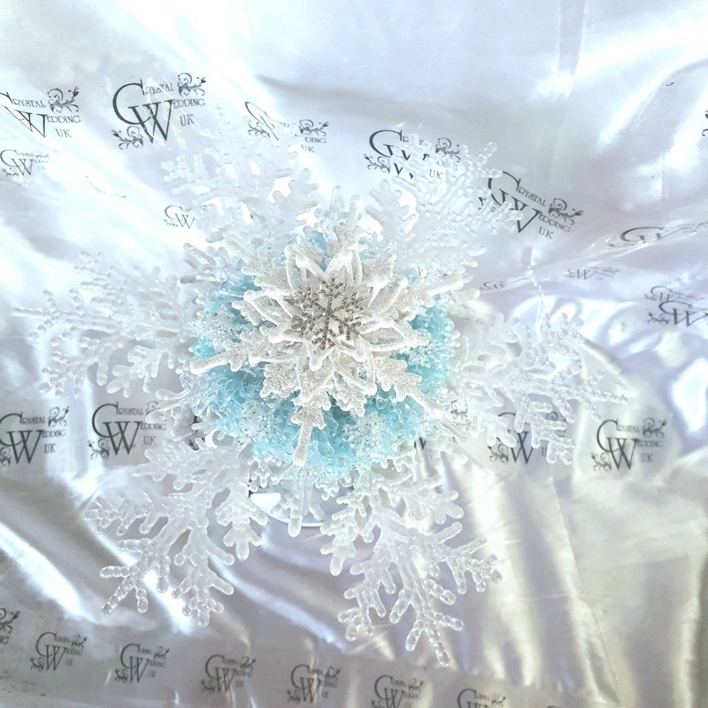Snowflake bouquet with frozen blue accent for a Winter wedding bridesmaid by Crystal wedding uk
